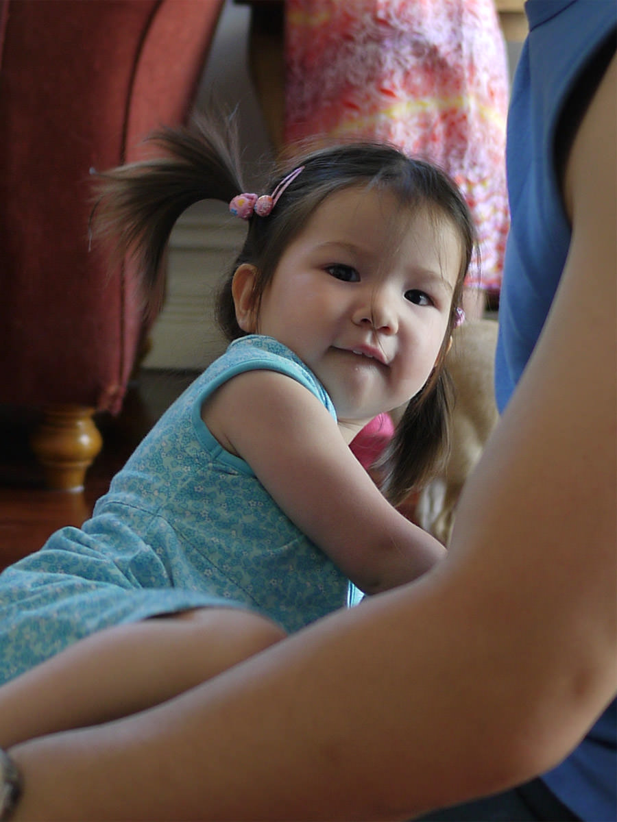 A happy face on Boxing Day: Zoe, climbing onto her dad's knee to play Horsey
