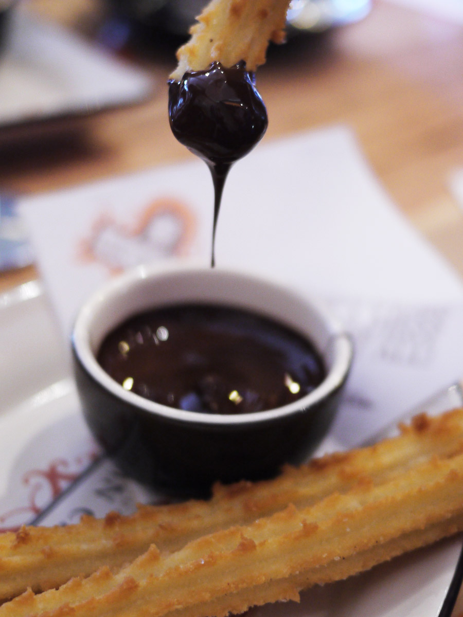 Churros with dark chocolate dipping sauce