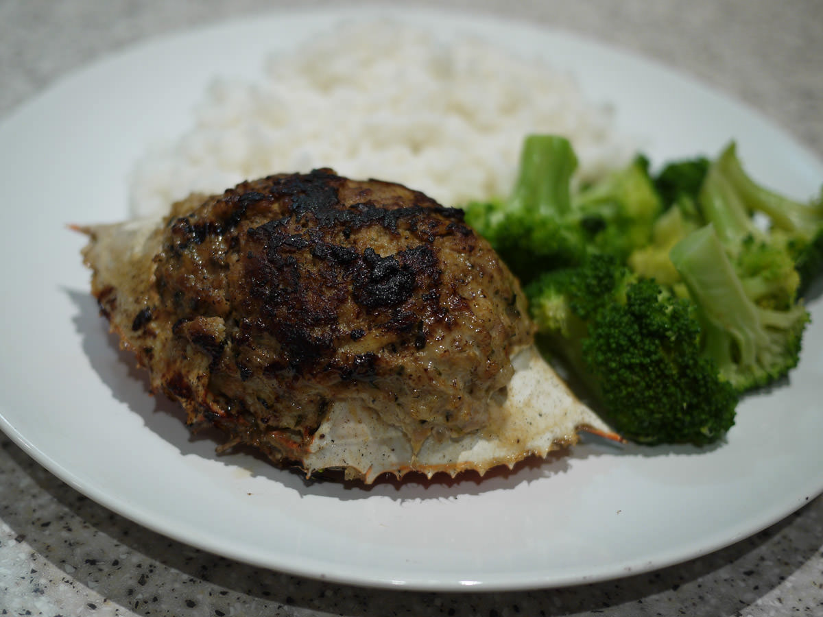 Pork and crab stuffed in crab shell with broccoli and rice