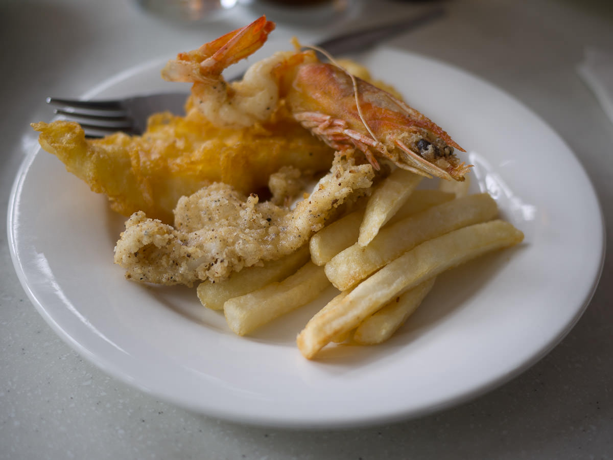 Seafood on a plate - squid, fish, prawn and chips
