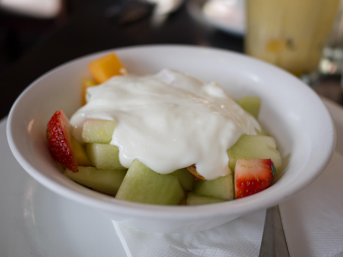 Fruit salad topped with natural yoghurt (AU$8.80)