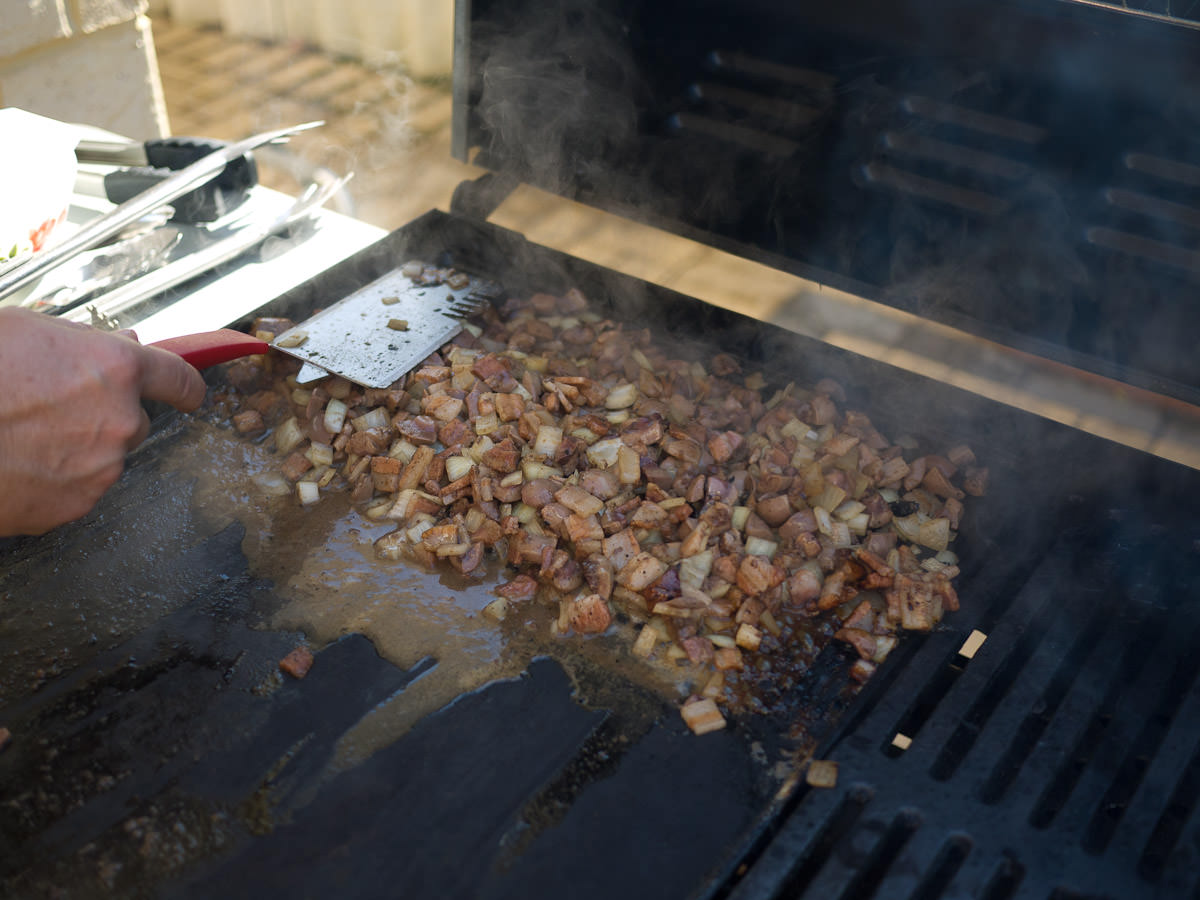Cooking the marsala kidneys, bacon and onions on the barbecue