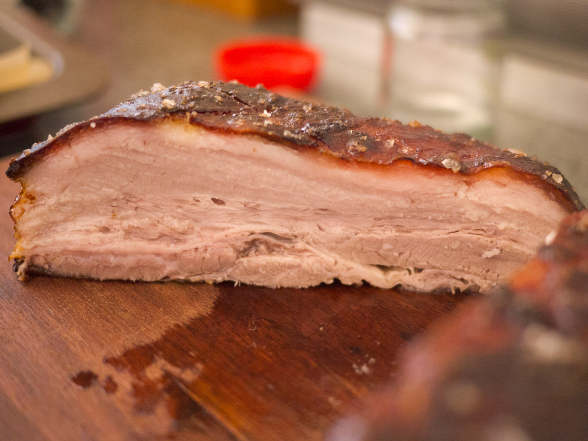 Slicing the slow-roasted pork