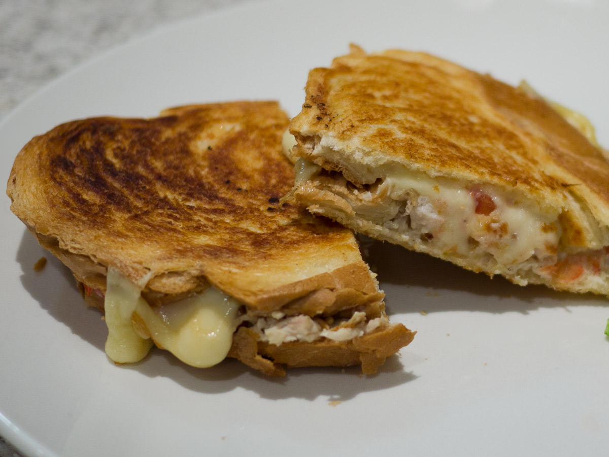 Toasted sandwich with barbecue chicken, mayo, swiss cheese, tomato, chardonnay wholegrain mustard