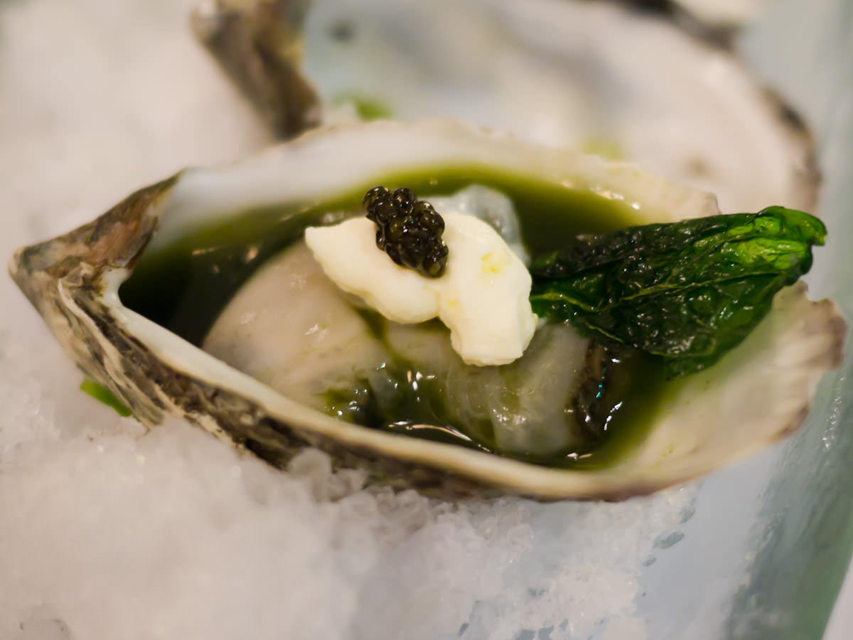 Oyster with basil jelly and caviar - close-up
