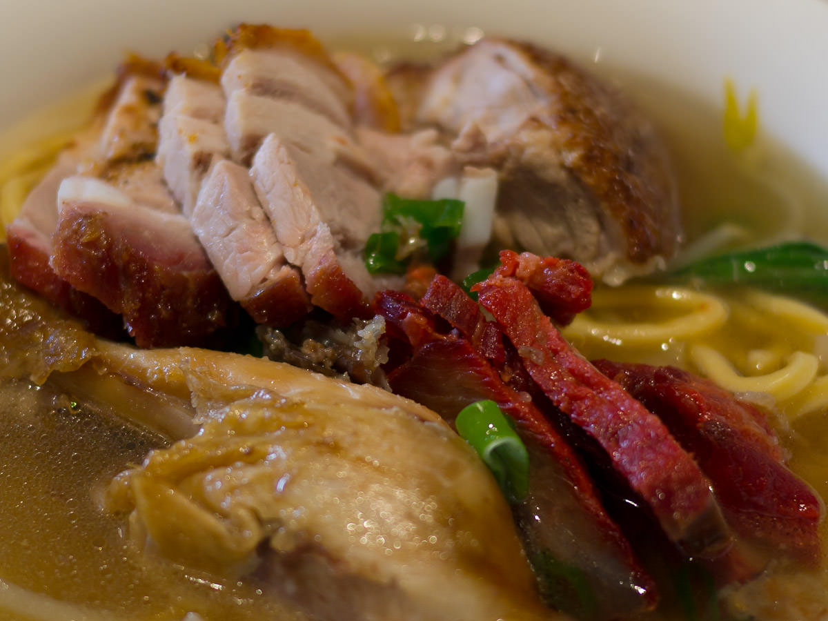 BBQ pork and roast pork, chicken and duck in soup - close-up