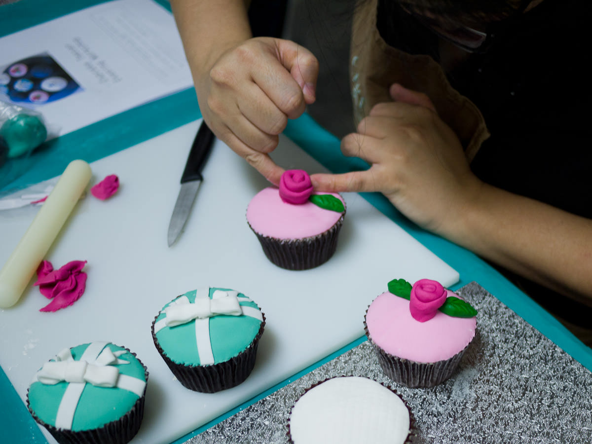 Me working on a fondant rose (photo by Winnie Lee)