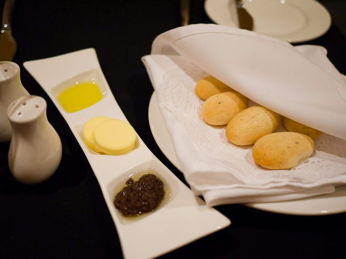 Parmesan bread with butter, olive oil and olive tapenade