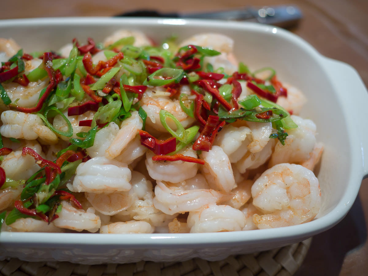 Prawns with garlic and ginger, garnished with homegrown chilli