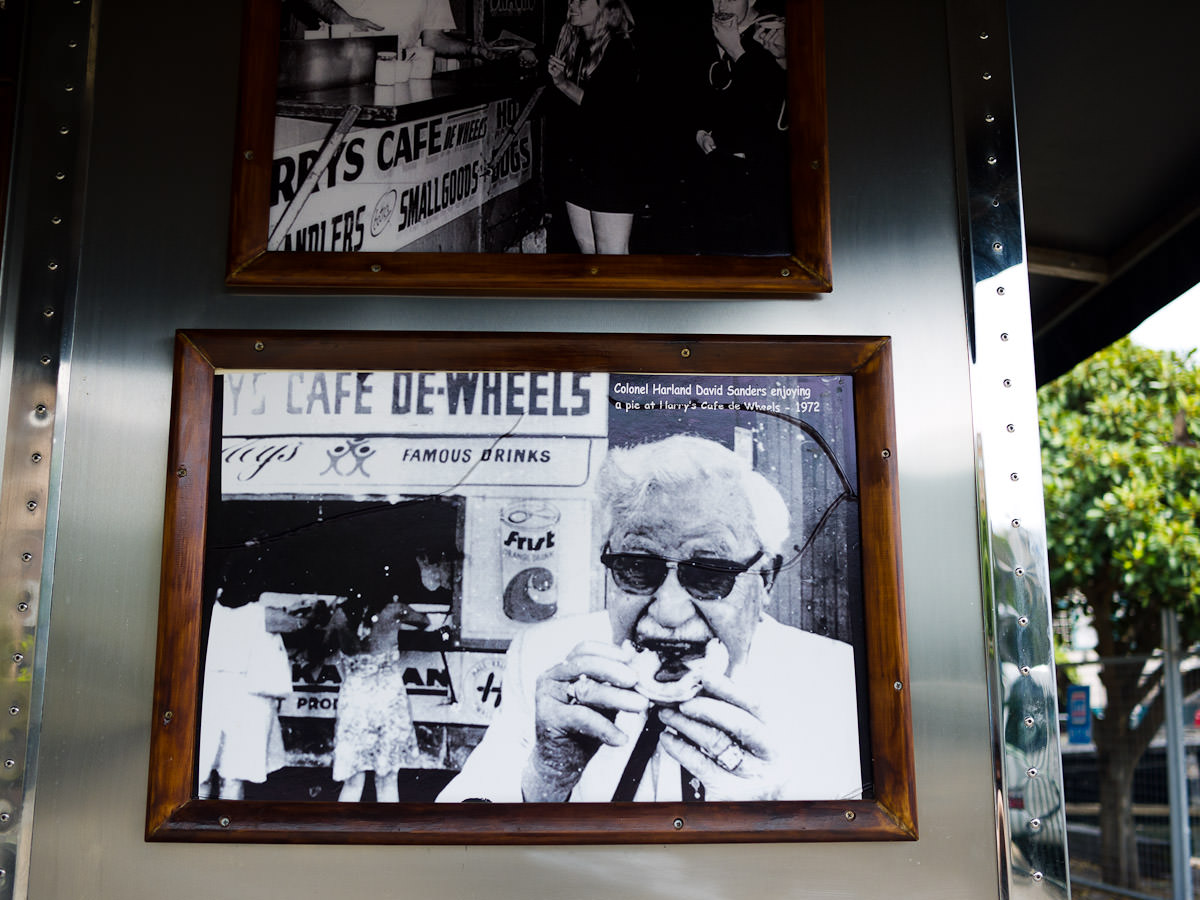 Photograph of Colonel Sanders eating a pie at Harry's Cafe de Wheels, 1972