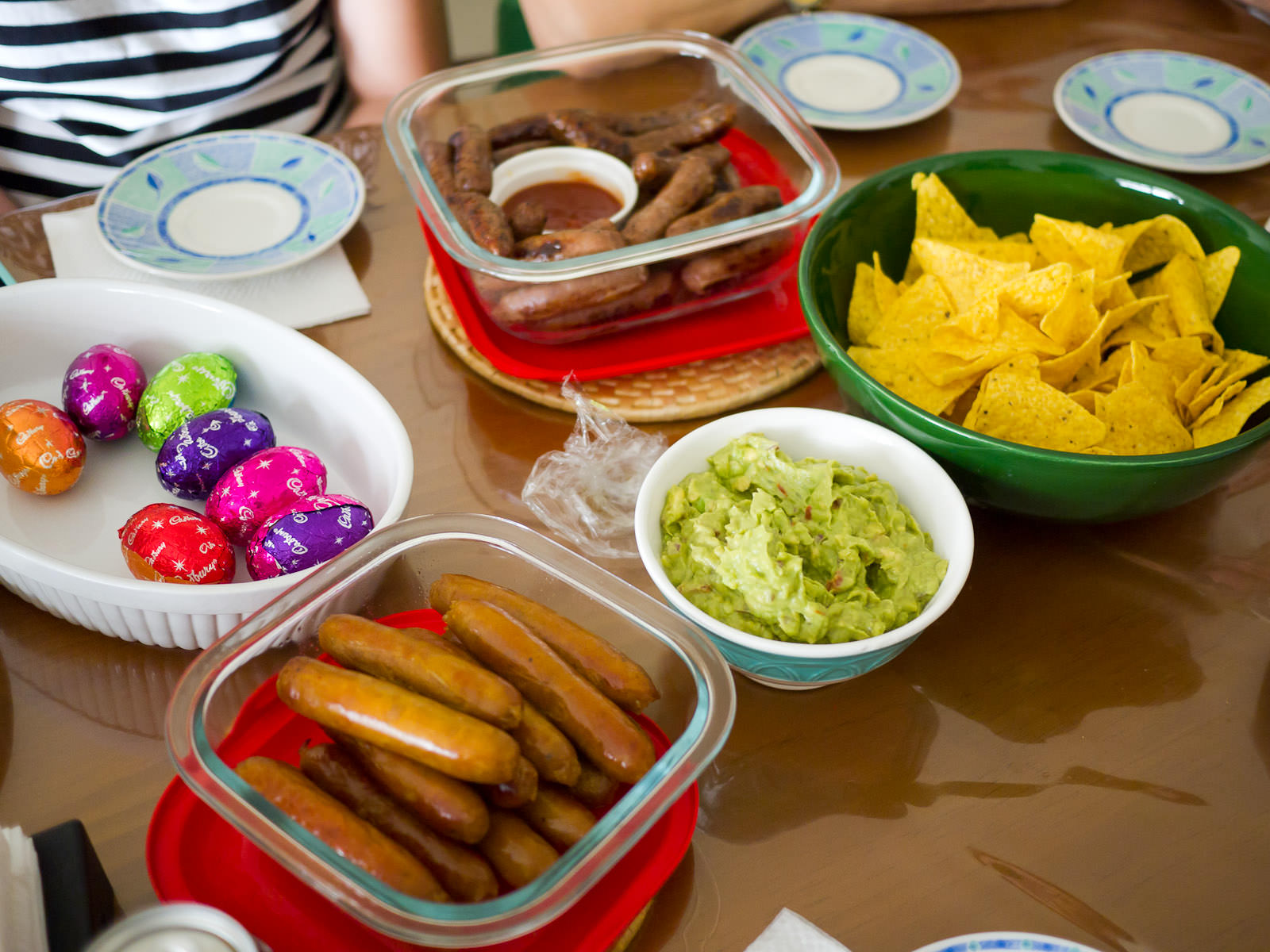 Easter eggs, Mexican beef, plain beef and curry sausages, guacamole and corn chips