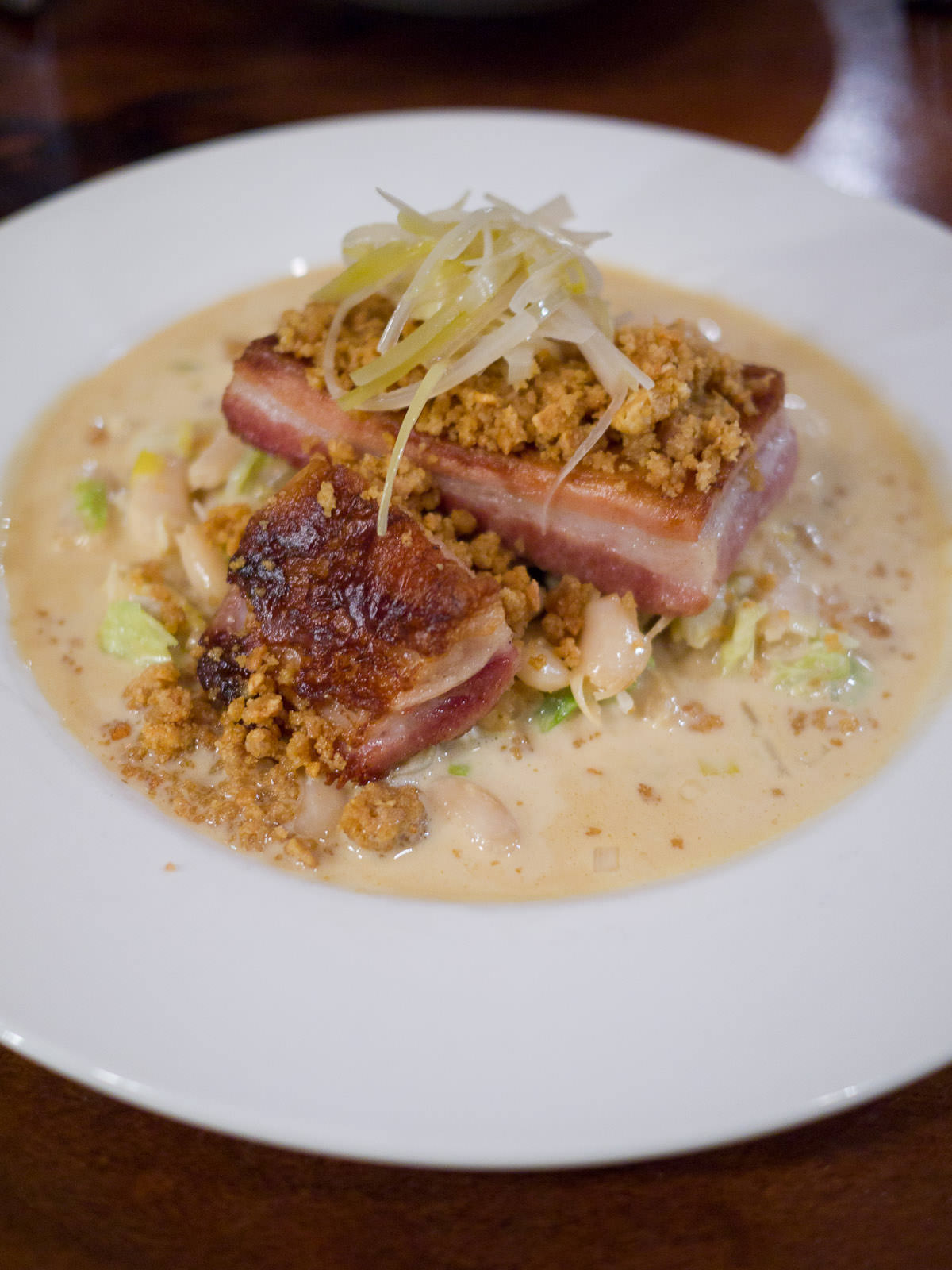 Slow cooked pork belly, beer braised cabbage, cannellini beans, crackle (AU$30)