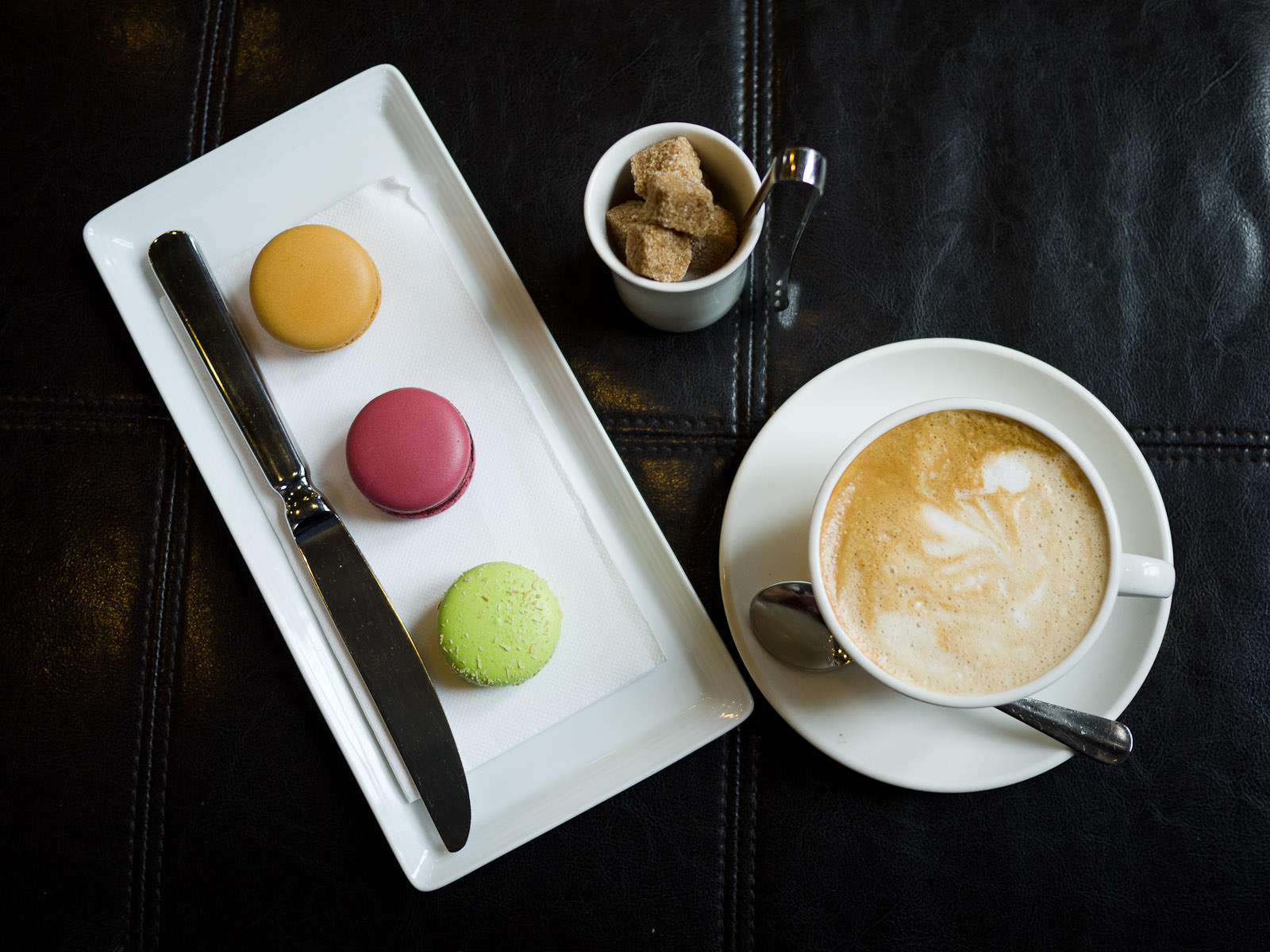 Salted caramel, blackcurrant and lime, mango and coconut macarons, soy flat white