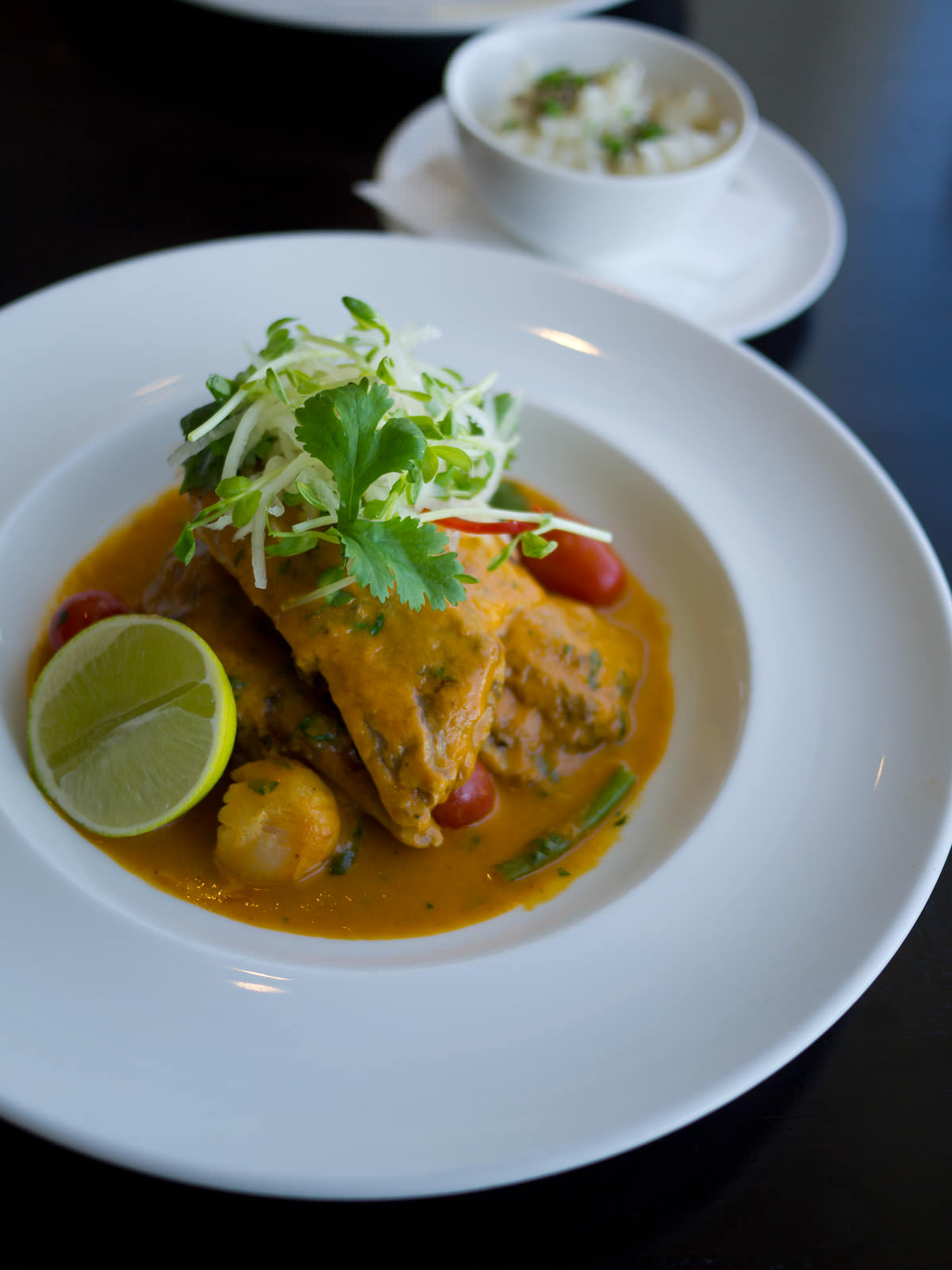 Double roasted duck, slow roasted in rich Thai curry sauce with lychees, tamarind, lemongrass & coconut rice (AU$45.50)