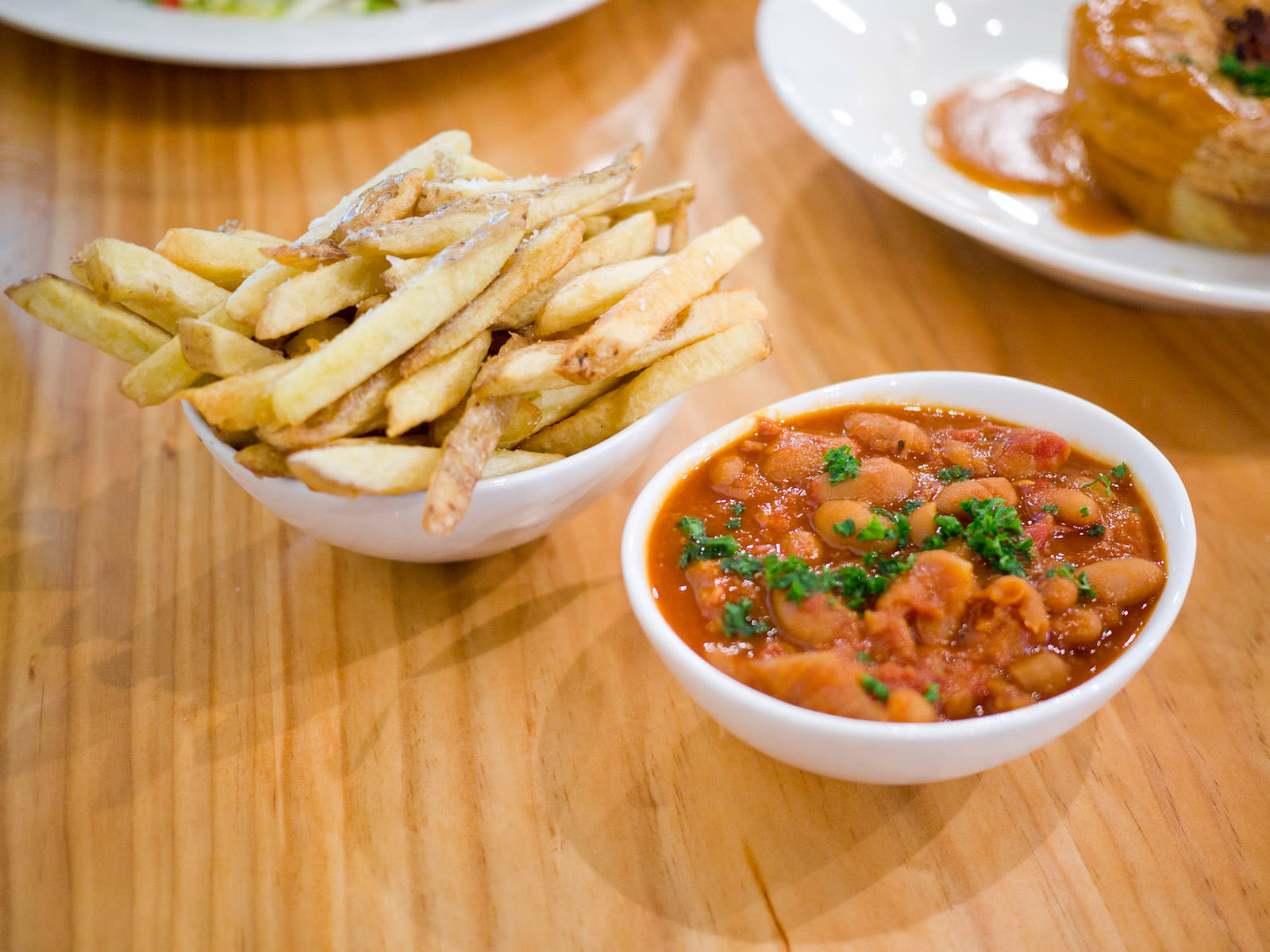 Hand cut chips (AU$4.50) and baked beans with smoked ham hock (AU$5)