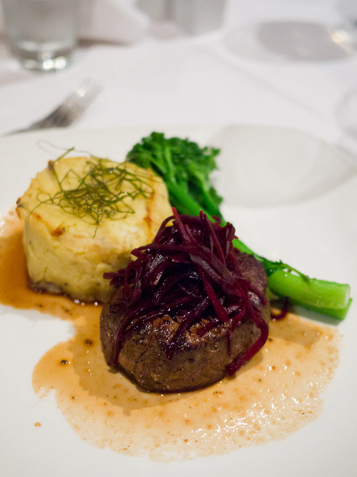 250g eye fillet with cabernet merlot jus, potato rösti scented with thyme, garlic buttered broccolini and beetroot pickles