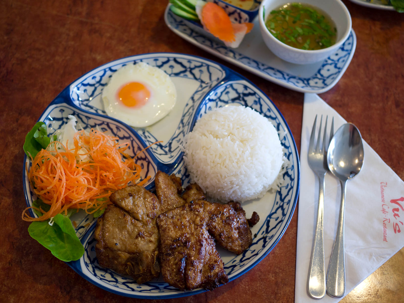 Com suong (Charcoal grilled pork chop, fried egg, rice and soup - AU$13.50)