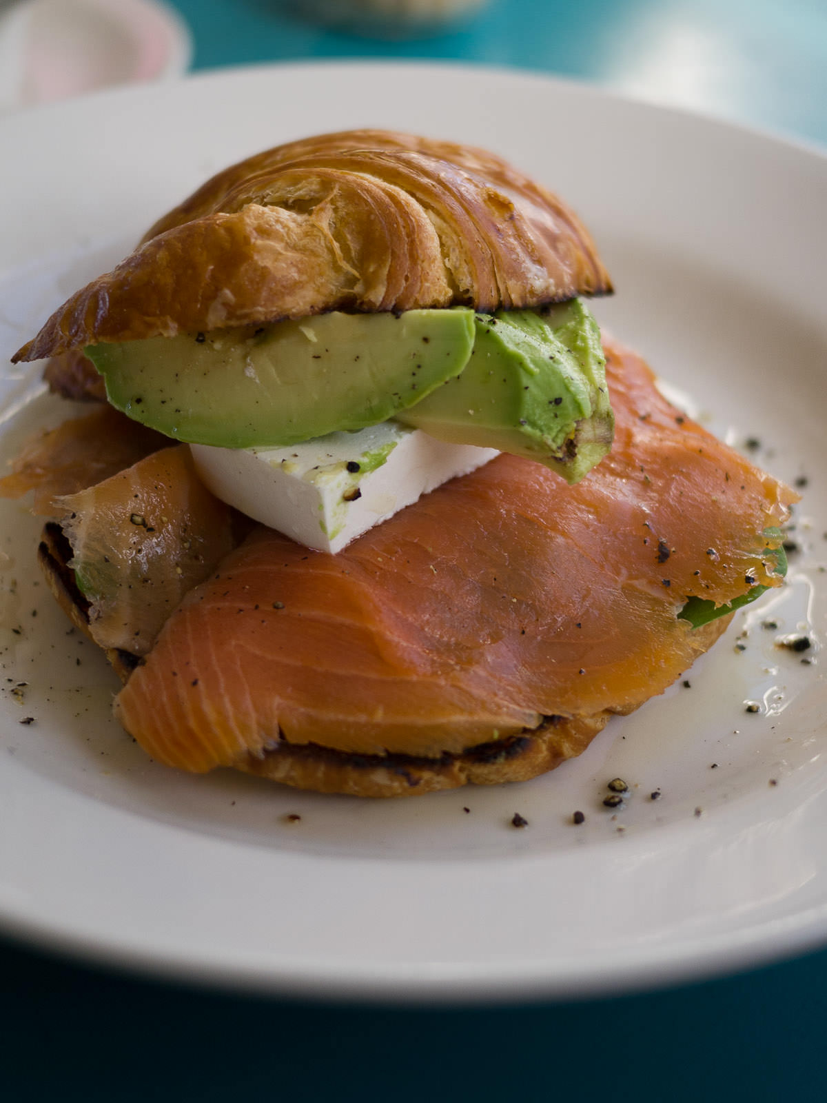 Croissant with smoked salmon, feta, spinach and avocado (AU$11.50)