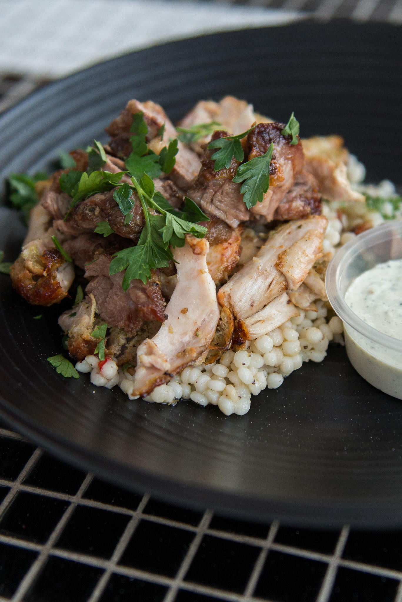 Marinated Arkady Margaret River lamb and Mount Barker chicken, cooked over charcoal, served with tzatziki and giant couscous (AU$27)