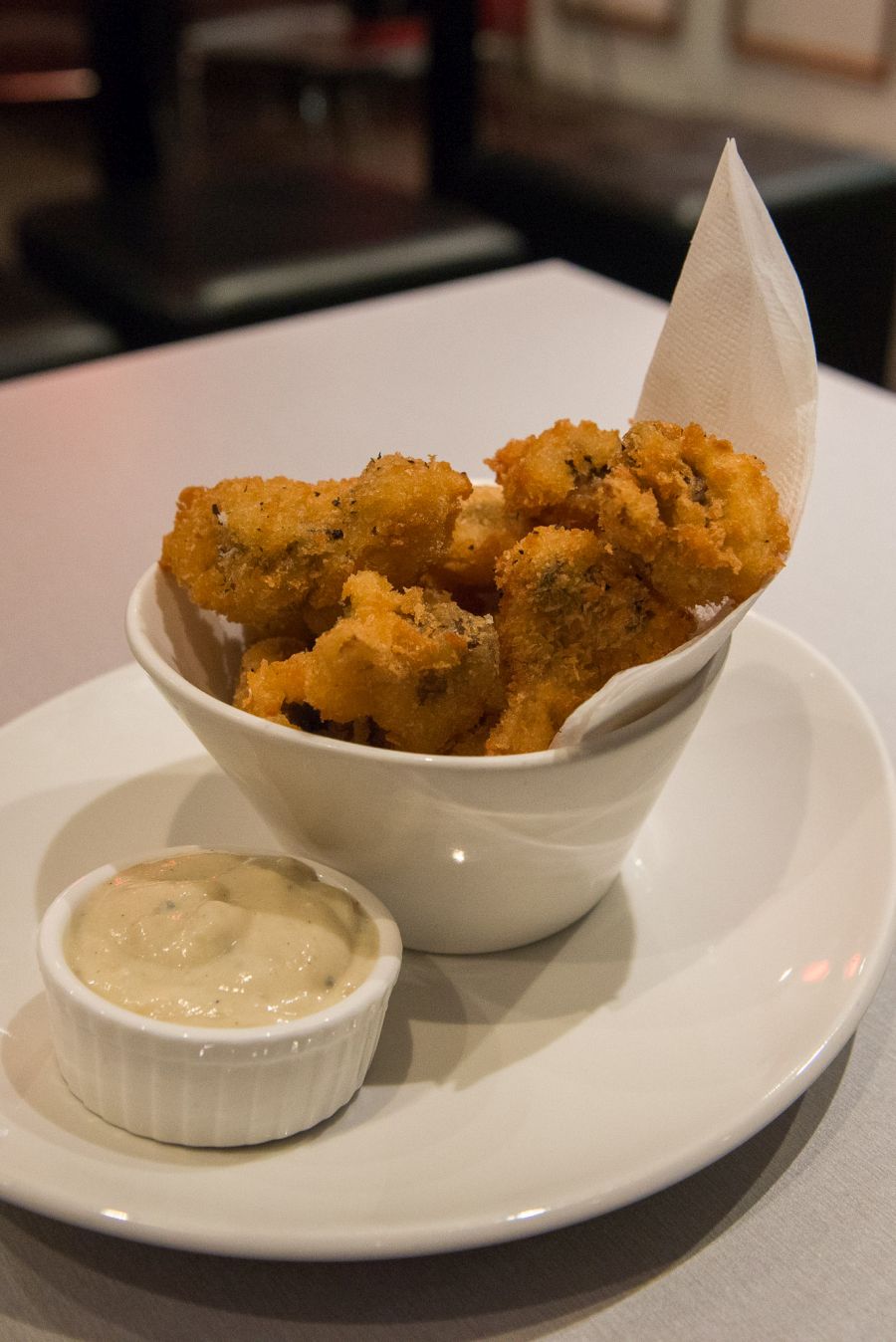 Crumbed mushrooms with blue cheese sauce (AU$8)