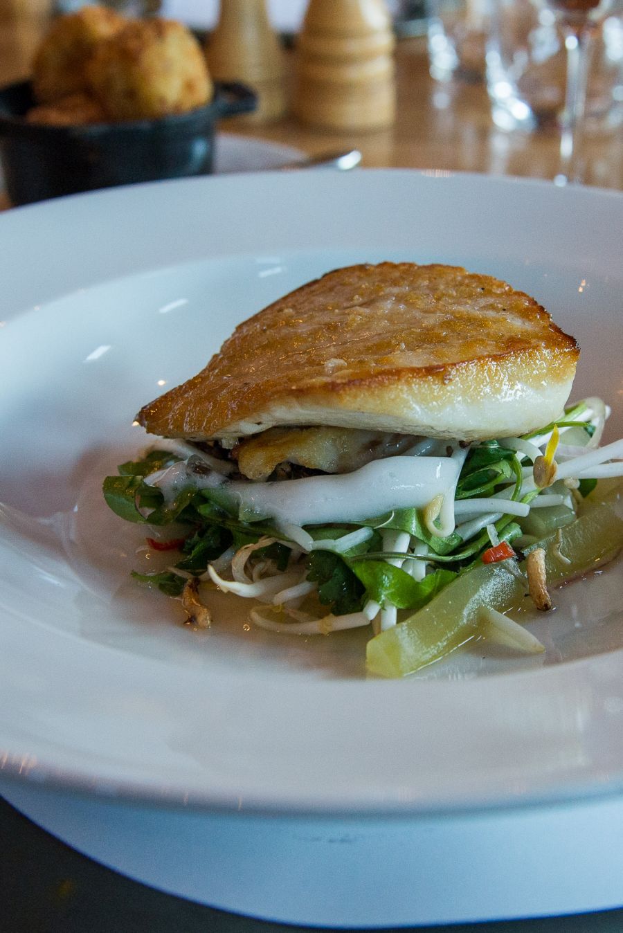Pan-fried line caught fish, cucumber, garden herb salad, sprouts, chilli and kaffir lime (NZ$37.50) - the fish of the day was blue nose.