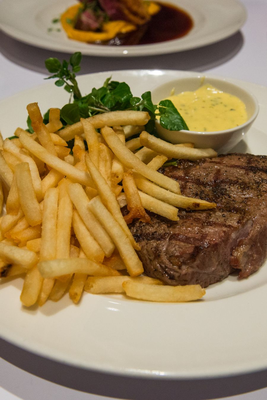 Chargrilled Butterfield sirloin steak (270g, dry aged for 28 days), bernaise sauce, frites, watercress salad (AU$46)
