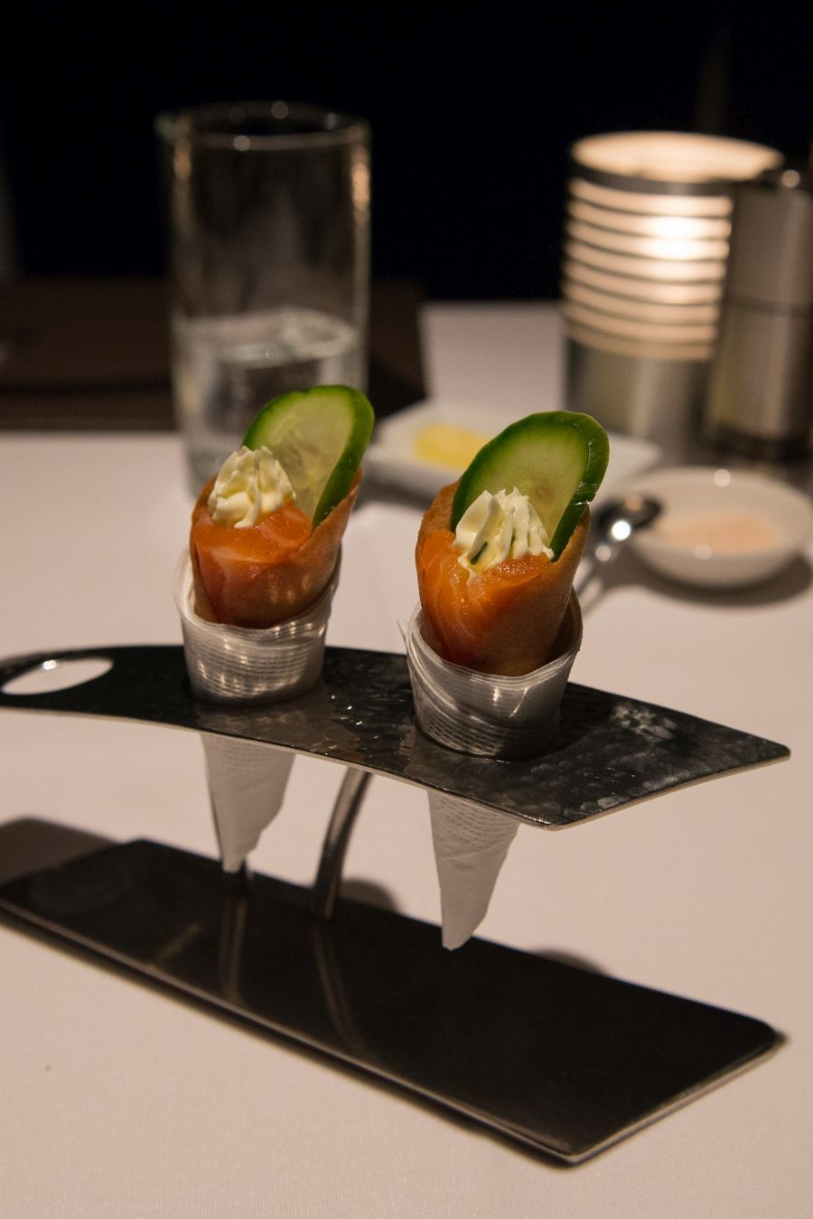 Amuse bouche - G&T cured salmon, cucumber and cream cheese in anchovy-flavoured cone