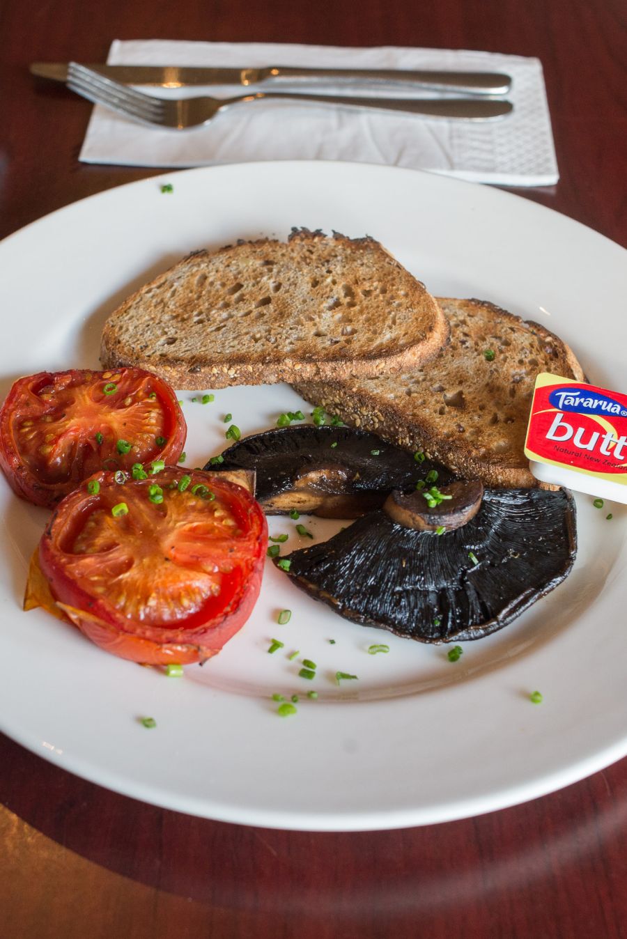 Field mushrooms and tomatoes with wholegrain toast (NZ$11)