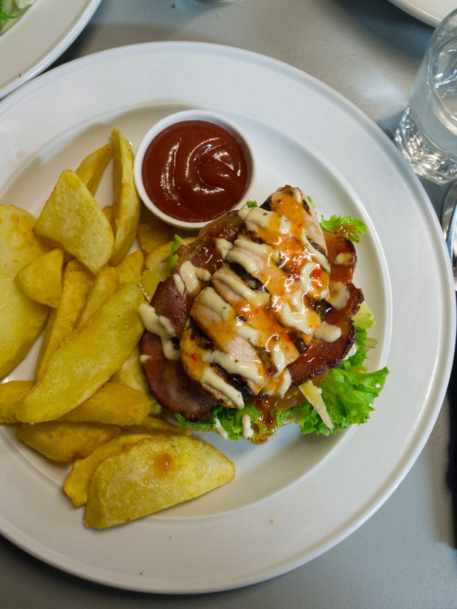 Open chicken and bacon sandwich served on sourdough with homemade chunky fries and sweet chilli sauce (NZ$16)