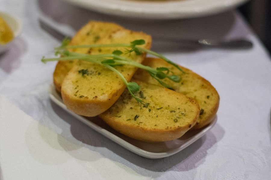 Crisp oven baked herb garlic bread (AU$3.50)