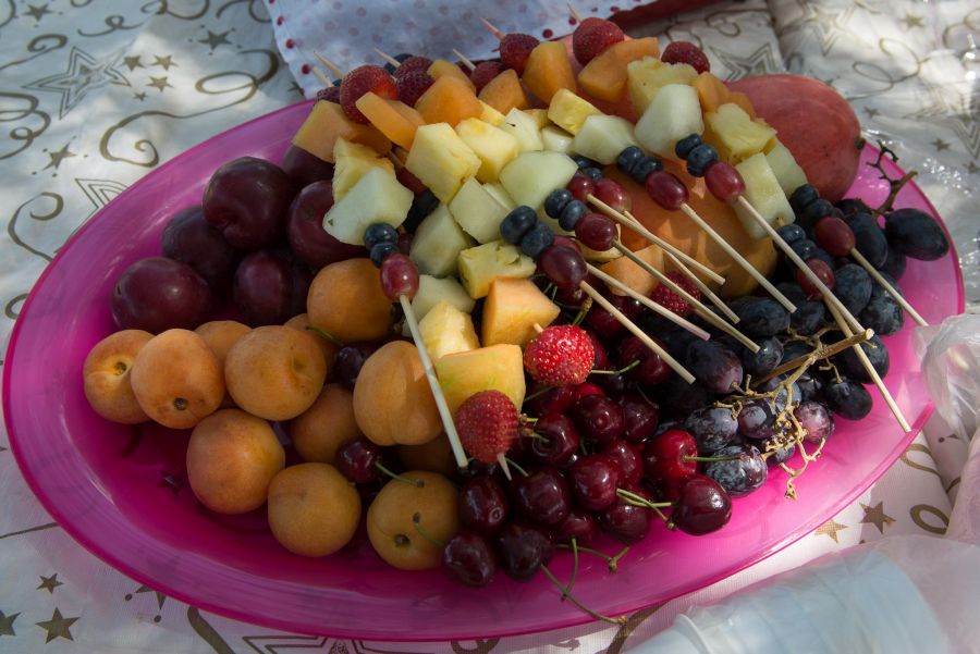 Fruit platter with whole fruit and fruit kebabs