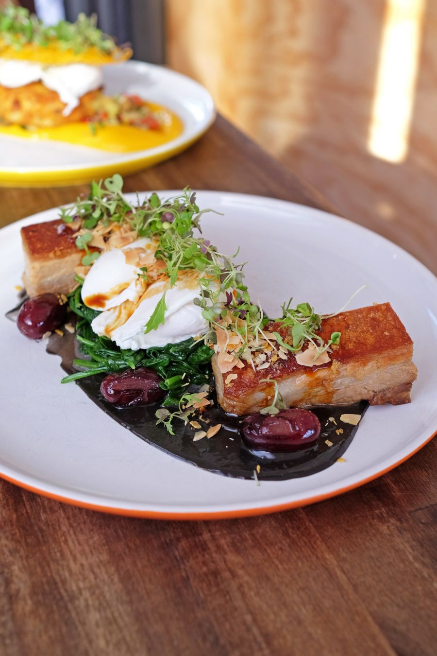 Pork Belly (AU$22.50) - two poached eggs, almond crumb, grapes, squid ink and anchovy sauce