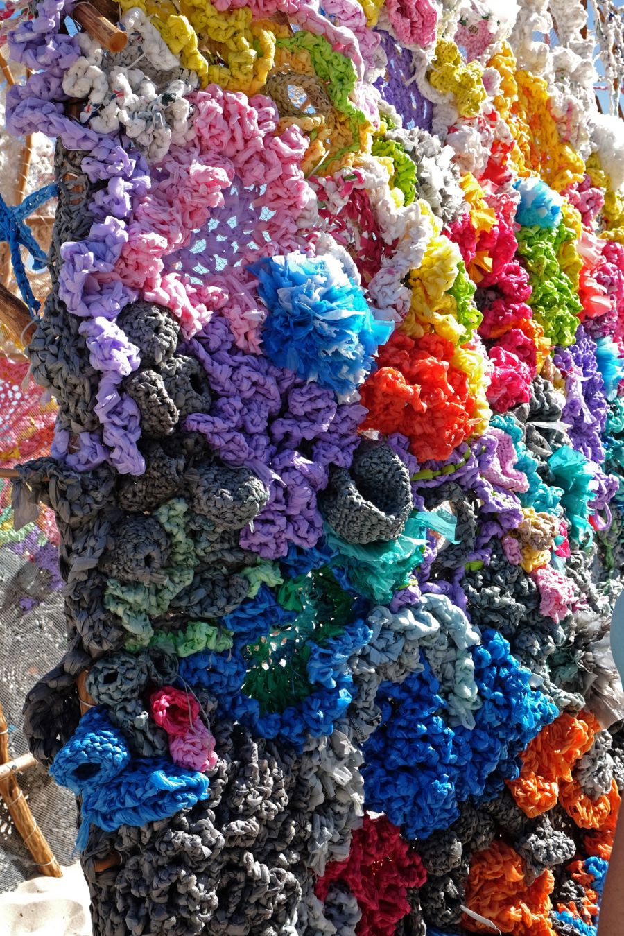 Rescheduling permanence by Helen Seiver. Wood, crocheted plastic bags - close up.