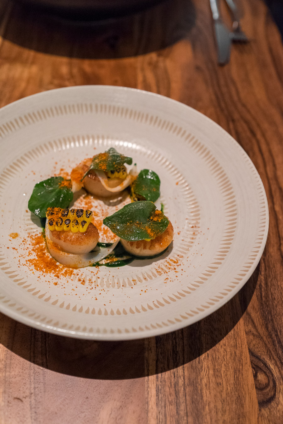 Scallops, corn, spinach + shaved squid