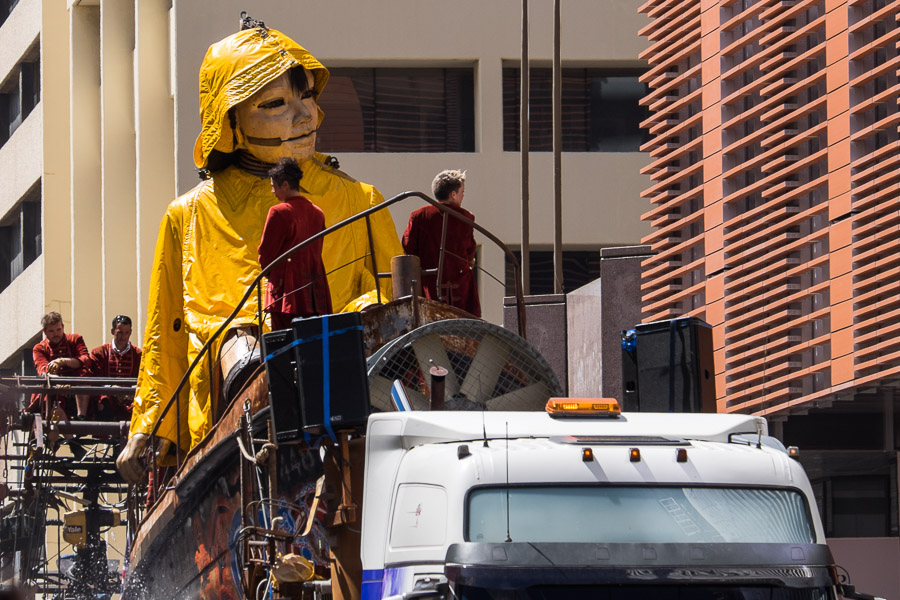 The Little Girl giant arrives dressed in a yellow sou'wester, sitting in a boat. Hay Street, Saturday.