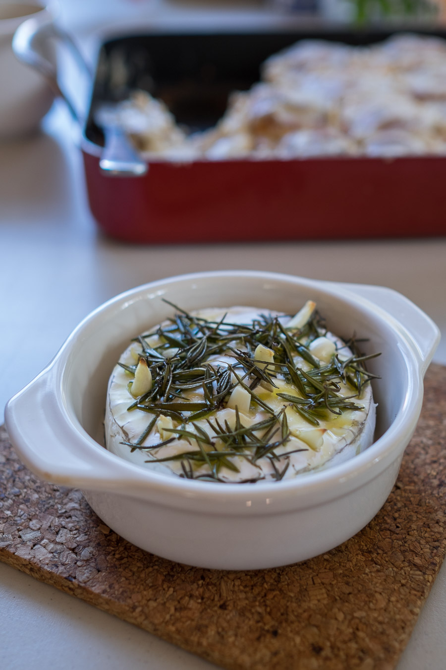 Camembert with rosemary, garlic and olive oil, ready for dipping.