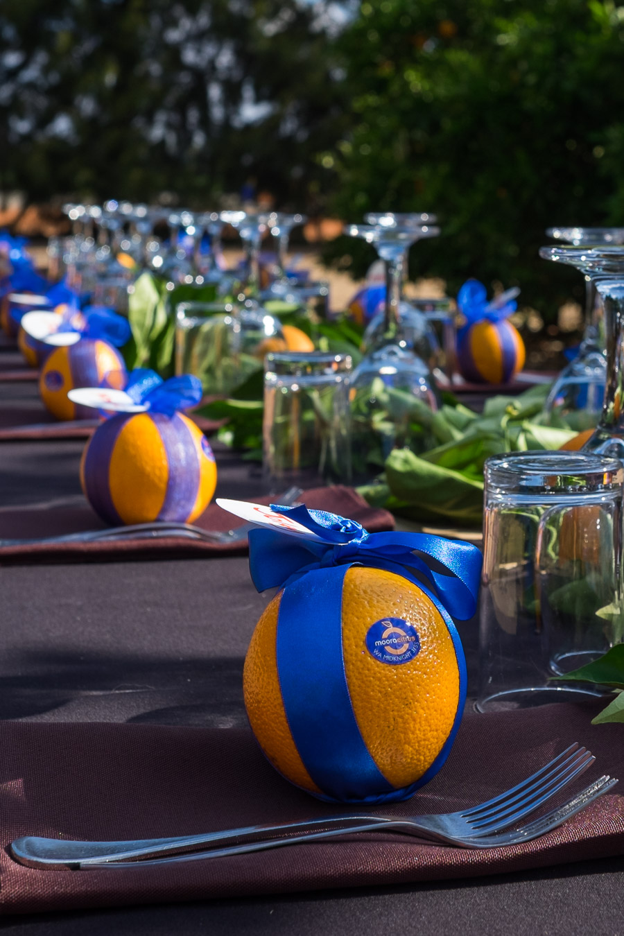 The table setting included a Midknight Summer orange for each guest. 