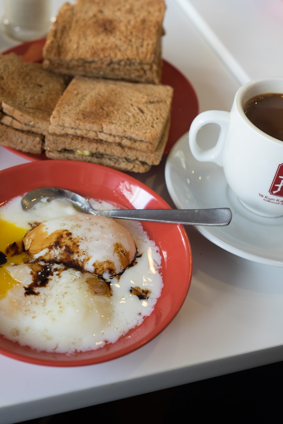 Kaya toast, soft boiled eggs and coffee c